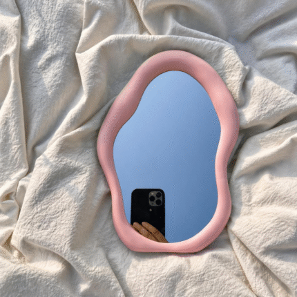 pastel pink, irregular cloud-shaped tabletop vanity mirror